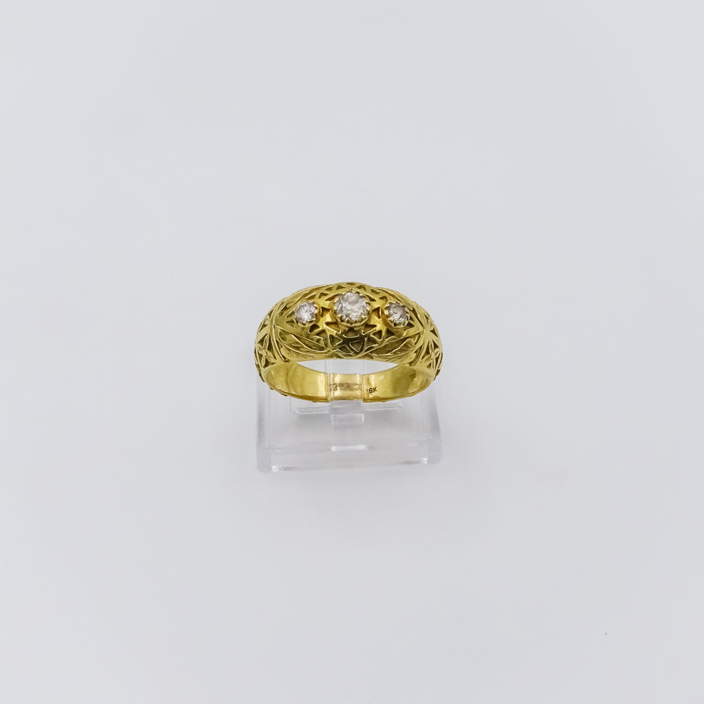 18k gold ring with three diamonds