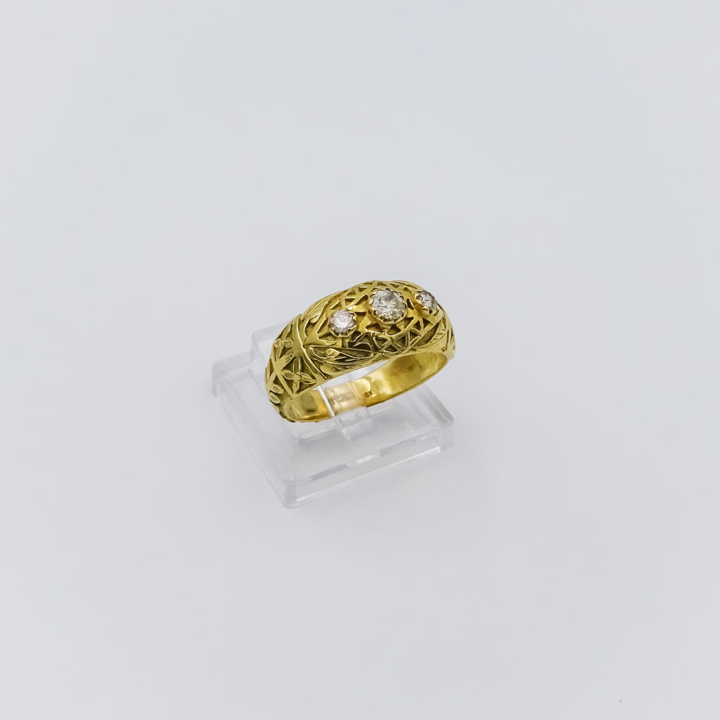 18k gold ring with three diamonds