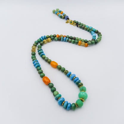 beaded necklace with 18k gold spacers,Chrisophrase,turquise,embar,rutile,sapphire and emerald