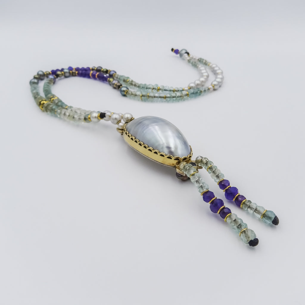 beaded necklace with 18k gold spacing,mother of pearl pendant,aqua marine,amethyst,silver&black pearls