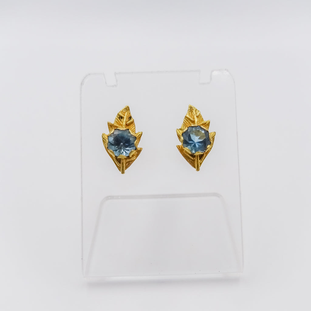 Nature's Serenity: 18K Gold Leaf-Shaped Earrings with Blue Topaz Gemstone