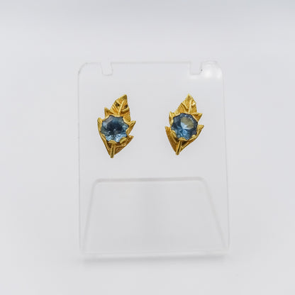 Nature's Serenity: 18K Gold Leaf-Shaped Earrings with Blue Topaz Gemstone
