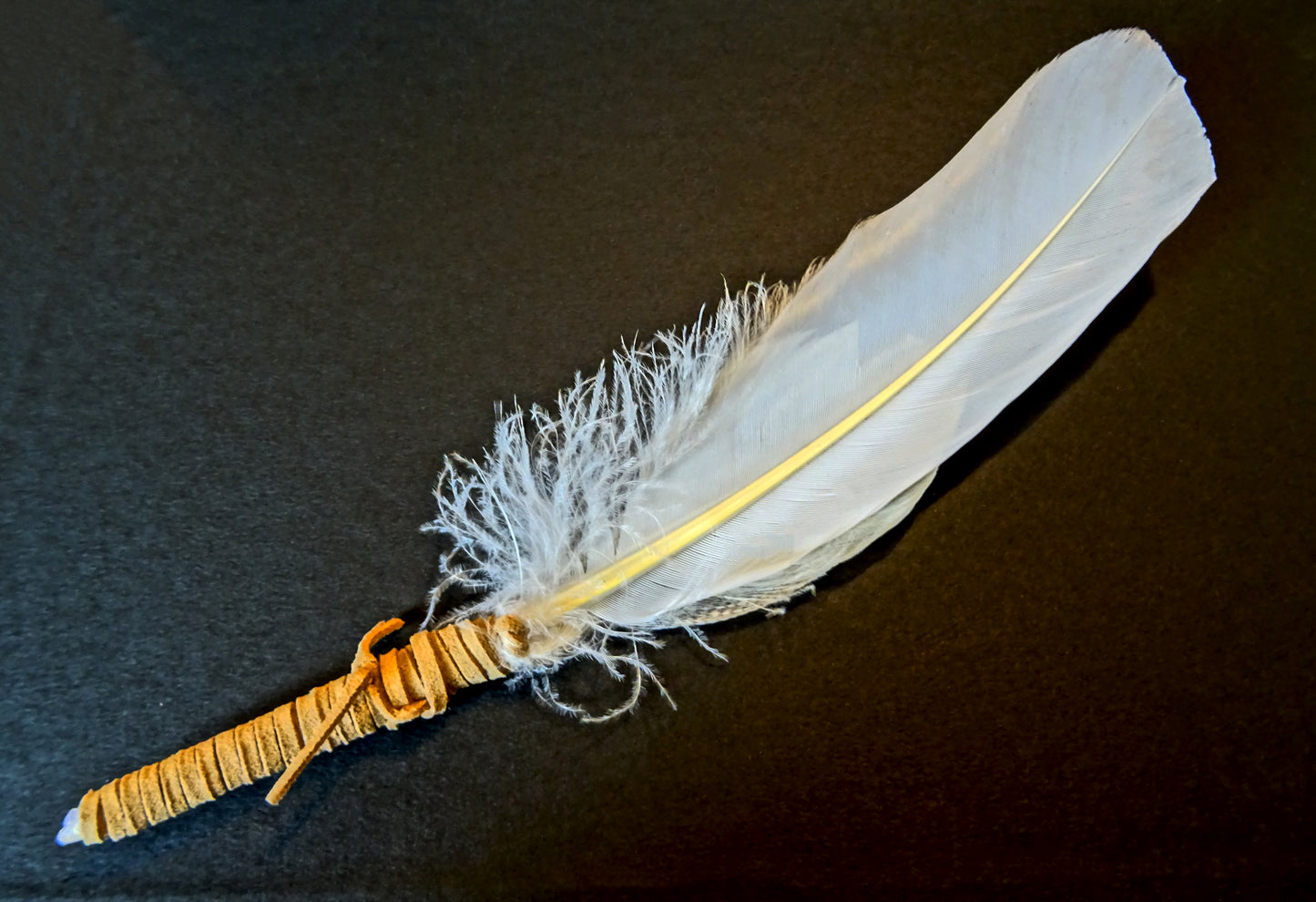 small sacred smudging fan, natural feathers