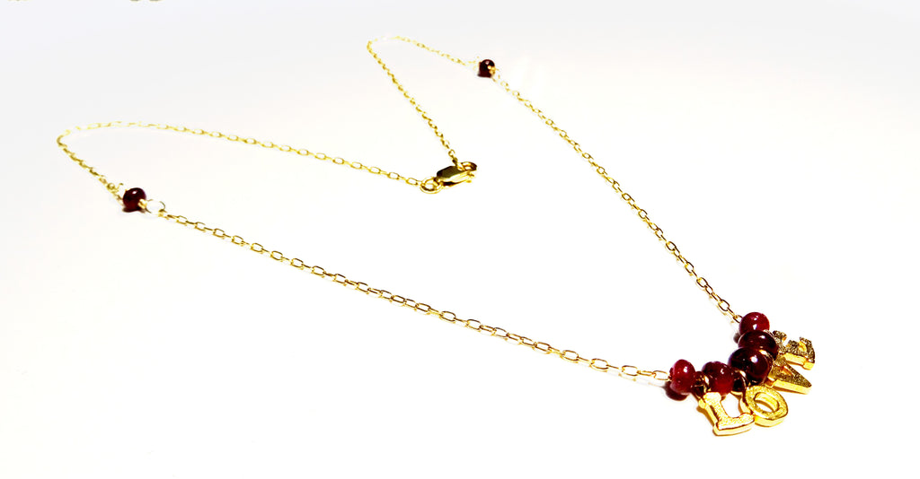 Gold filled necklace with gemstones Ruby beads with the letters love