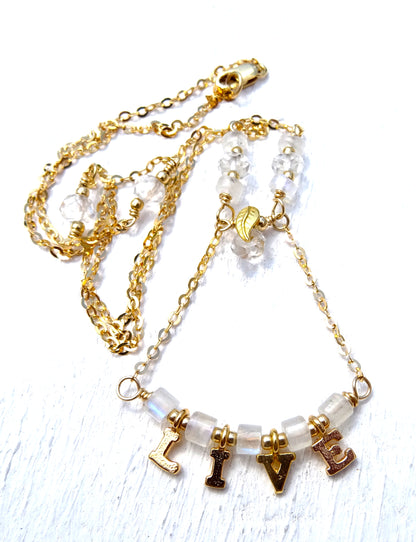 Gold filled necklace with gemstones,rainbow moonstone and crystal quartz with letters live